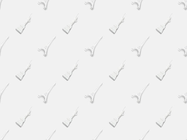 top view of eiffel tower statuettes and small statue of liberty isolated on white 