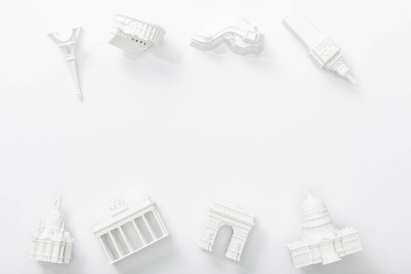 top view of small statuettes from countries isolated on white 