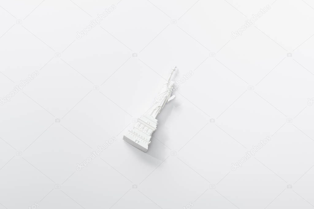 top view of little statue of liberty isolated on white 