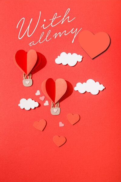 top view of paper heart shaped air balloons in clouds near with all my lettering on red background