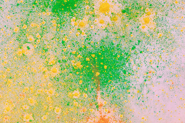 orange, yellow and green colorful holi paint explosion