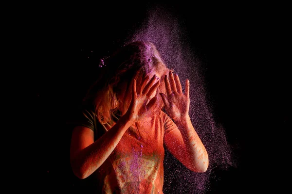 Woman Covering Face Violet Colorful Holi Paint Cloud Black Background — 스톡 사진