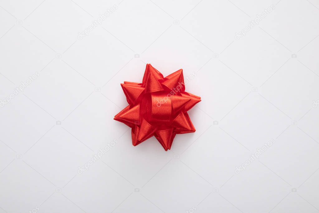 top view of red decorative bow isolated on white