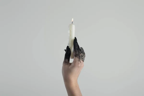 Cropped View Witch Hand Jewelry Ring Black Paint Holding Candle — 스톡 사진
