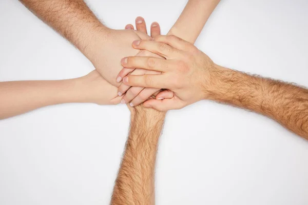 Vista Superior Homens Mulheres Mãos Dadas Isoladas Branco — Fotografia de Stock