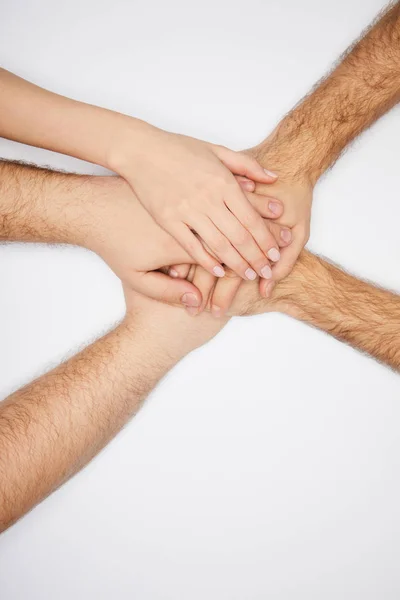 Vista Superior Homens Mulheres Mãos Dadas Isoladas Branco — Fotografia de Stock