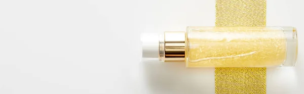 Top View Bottle Cosmetic Oil Golden Stripe White Background Panoramic — Stock Photo, Image