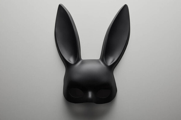 top view of black rabbit mask on white background