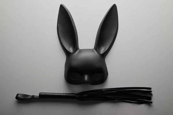 Top View Black Rabbit Mask Flogging Whip White Background — Stock Photo, Image