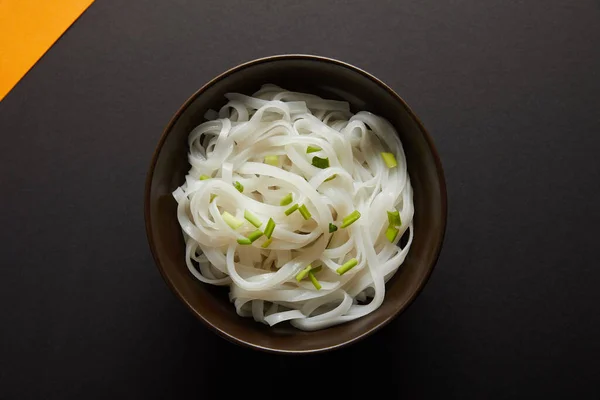 Top View Rice Noodles Bowl Yellow Black Surface — 스톡 사진