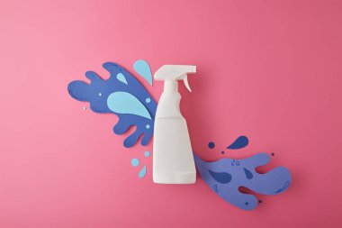 composition with spray bottle and blue water splashes made of paper, on pink clipart