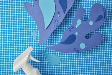 spray bottle and blue water splashes made of paper, on blue clipart