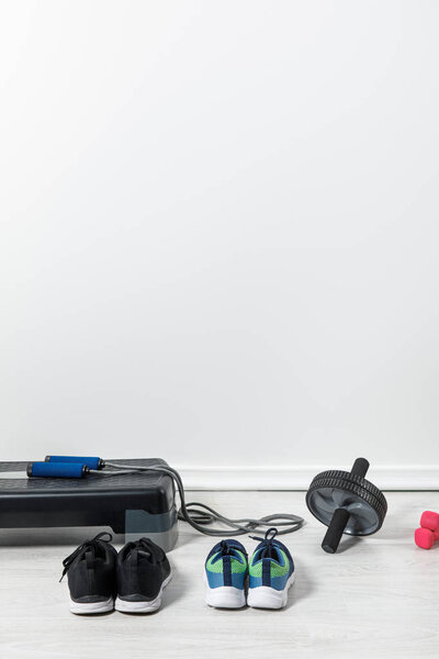 step platform and sport equipment on floor at home 