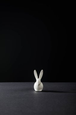 Decorative bunny isolated on black background, panoramic shot clipart