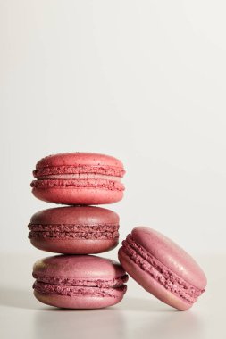 delicious red french macaroons on white background clipart