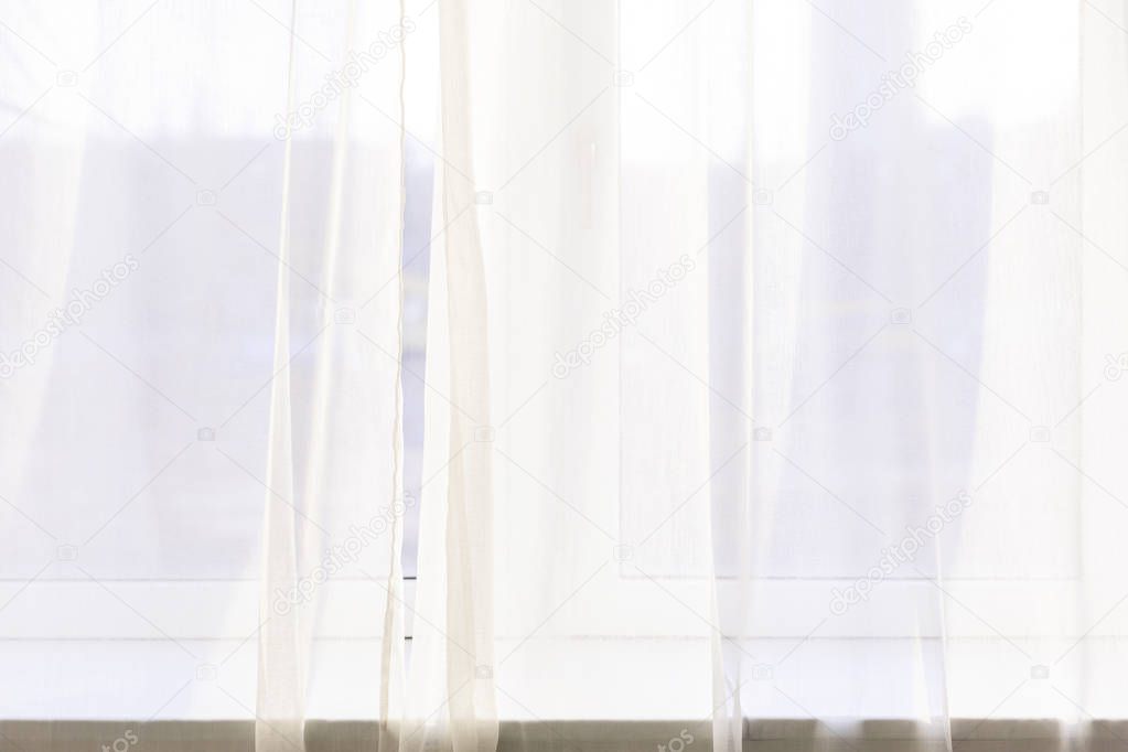 white tulle near windows in yoga studio 
