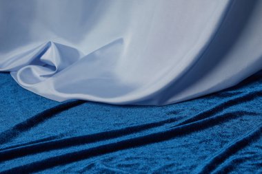 close up view of blue soft and crumpled silk and velour textured cloth clipart