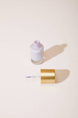 High angle view of opened bottle of nail polish on white background clipart