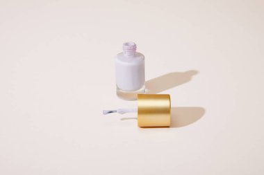 High angle view of opened bottle of nail polish on white  clipart