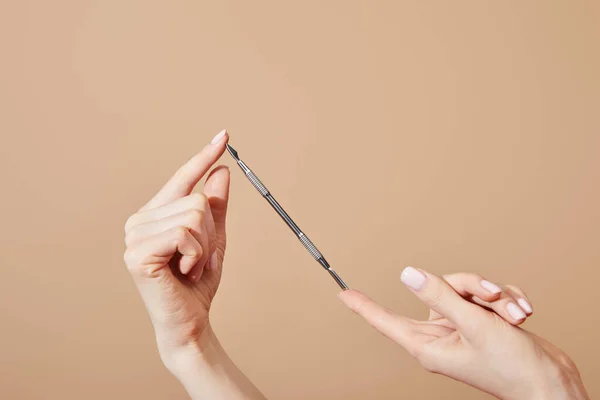 Cropped View Female Hands Cuticle Pusher Isolated Beige — Stock Photo, Image
