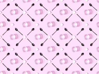 top view of lump sugar with black spoons and water on violet, seamless background pattern clipart