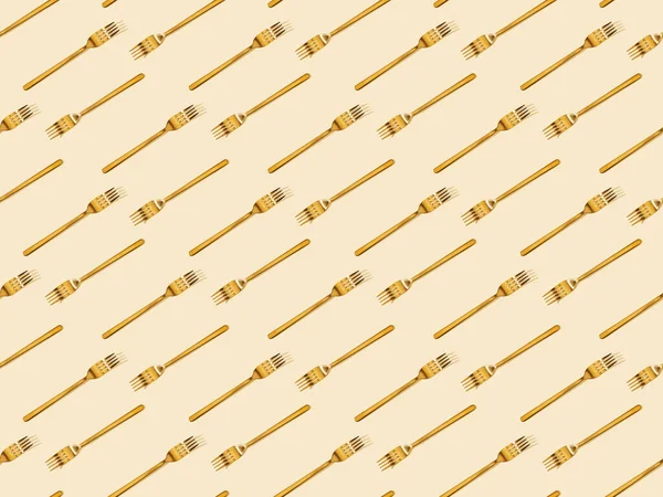 Top View Golden Forks Isolated Beige Seamless Background Pattern — Stock Photo, Image