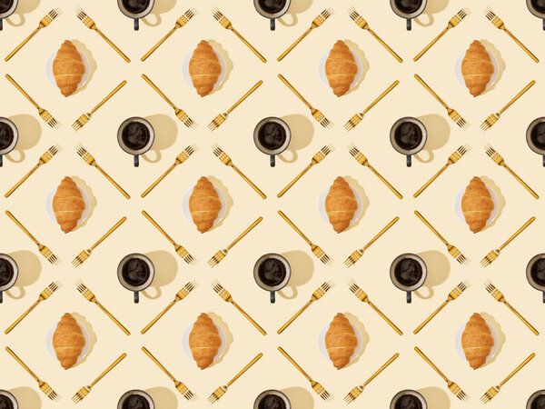 top view of golden forks, croissants and coffee on beige, seamless background pattern