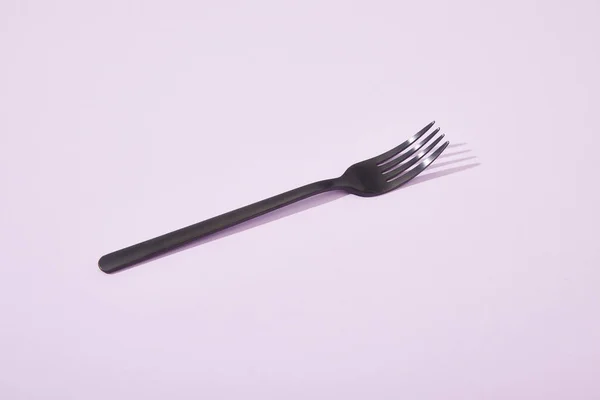 Metal Shiny Black Fork Violet Background — Stock Photo, Image