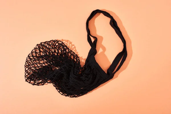 Bovenaanzicht Van Zwarte String Bag Oranje Achtergrond — Stockfoto