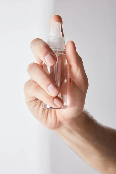 Cropped View Man Holding Hand Sanitizer Spray Bottle Grey Background — Stock Photo, Image