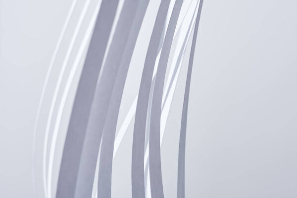 close up view of paper stripes on white background