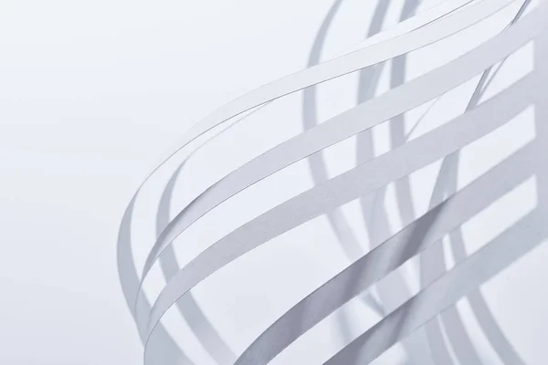 close up view of paper stripes on white background