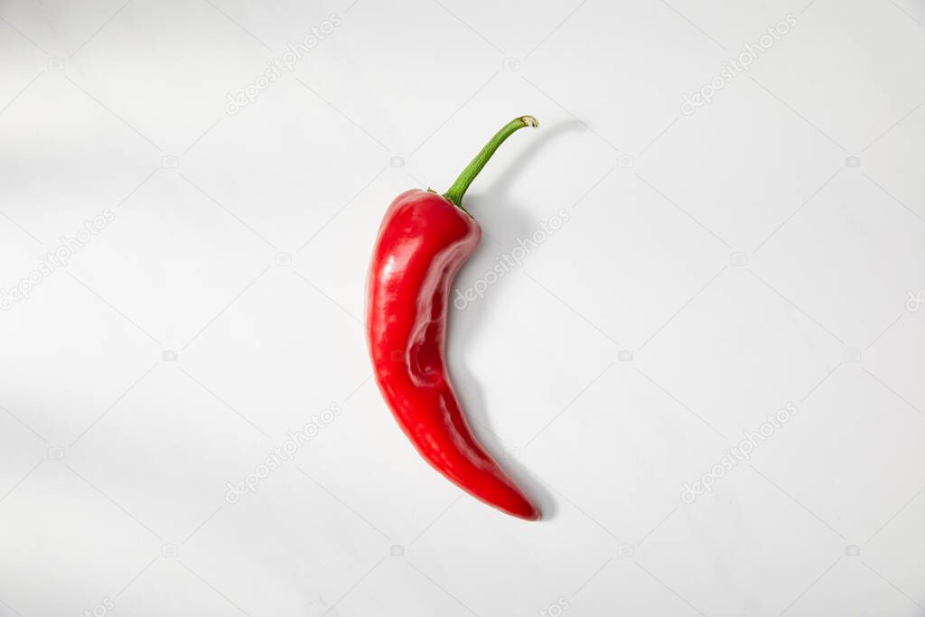 Top view of red chili pepper on white background
