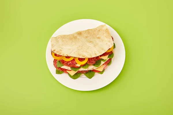 Fresh Sandwich Salami Pita Vegetables Cheese Plate Green Background — Stock Photo, Image