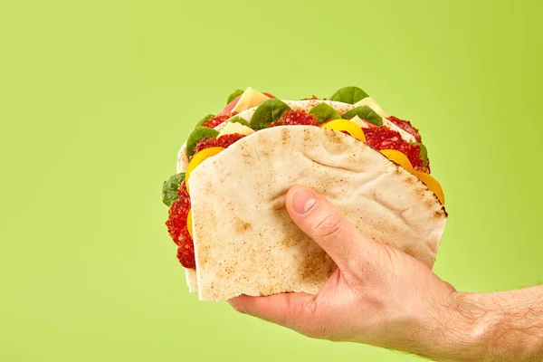 Partial View Man Holding Fresh Sandwich Salami Pita Vegetables Cheese — Stock Photo, Image