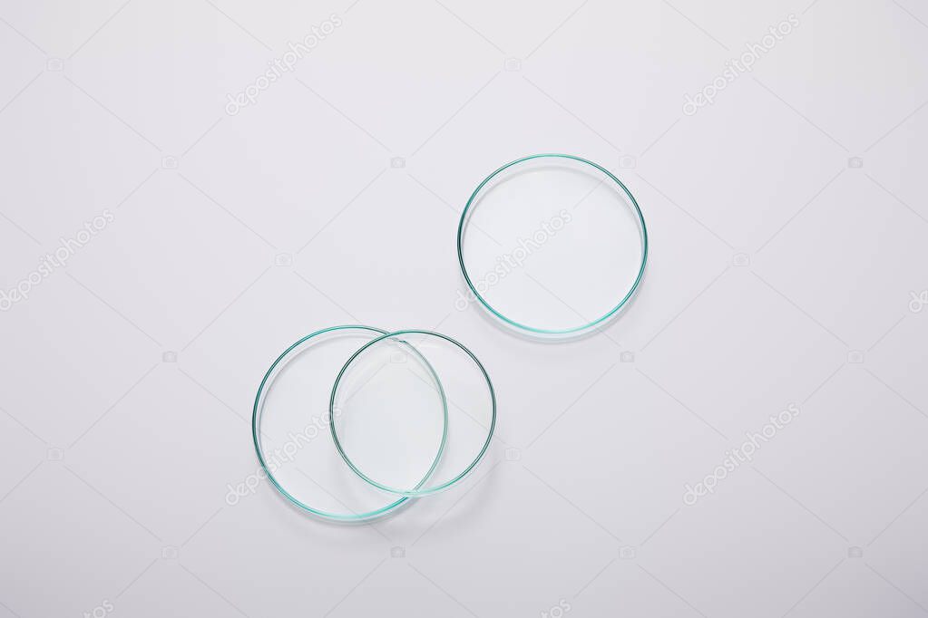 Top view of laboratory glassware on grey background