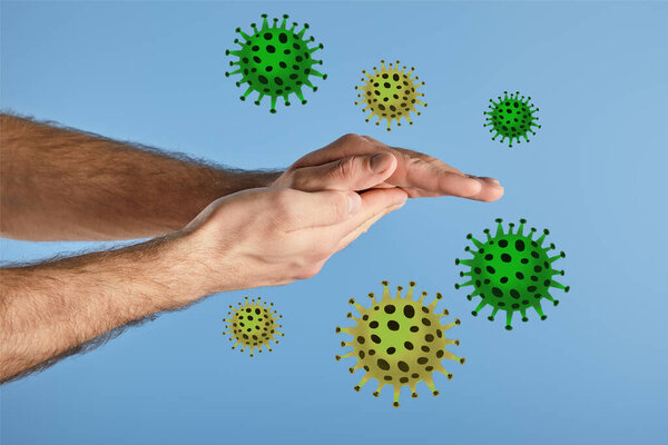 partial view of man washing hands isolated on blue, bacteria illustration
