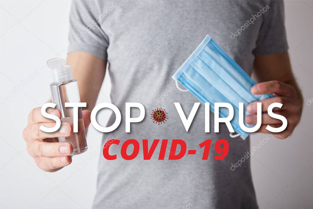 cropped view of man holding gel hand sanitizer in bottle and medical mask on grey background, stop virus illustration