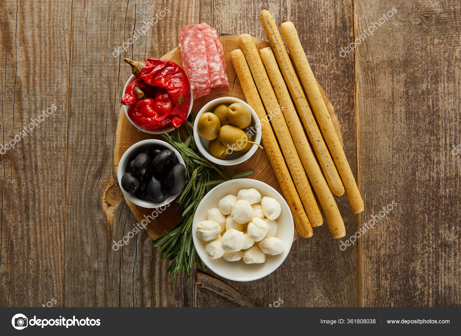 Top View Breadsticks Salami Slices Rosemary Bowls Antipasto Ingredients