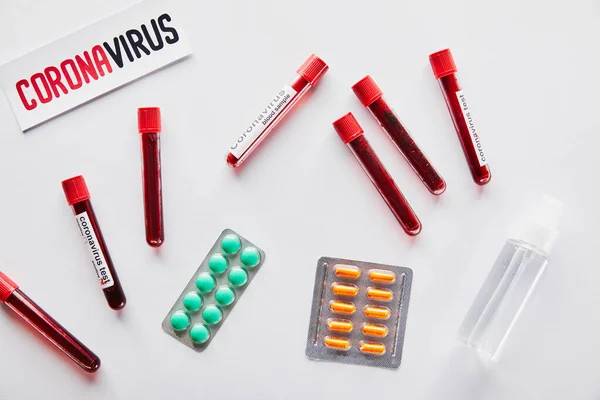 Top View Paper Coronavirus Lettering Test Tubes Hand Sanitizer Pills — Stock Photo, Image