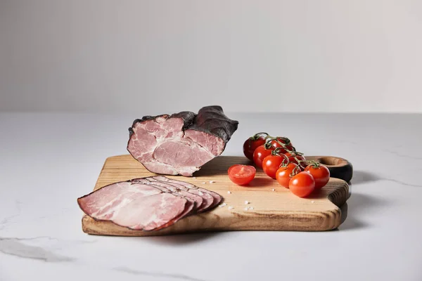 Tasty Ham Cutting Board Salt Cherry Tomatoes White Marble Surface — Stock Photo, Image