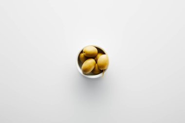 Top view of bowl with olives on white background  clipart