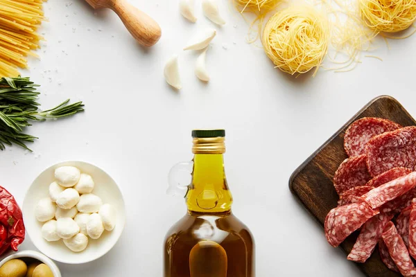 Top View Bottle Olive Oil Meat Platter Pasta Ingredients White — Stock Photo, Image