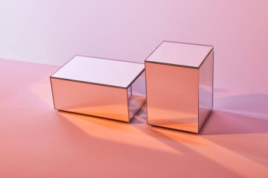 cubes with light reflection on surface on pink background clipart