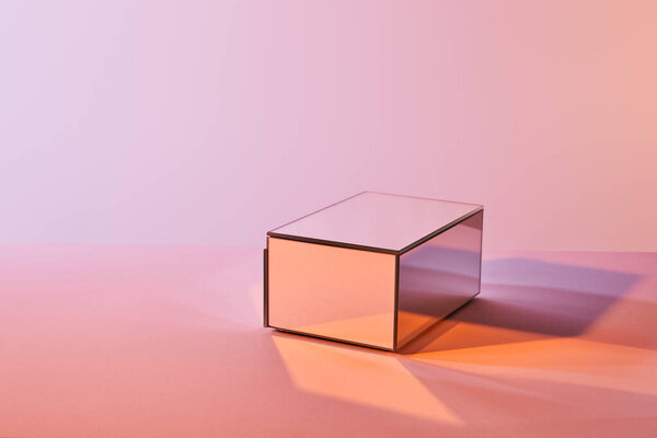 cube with light reflection on surface on violet and pink background