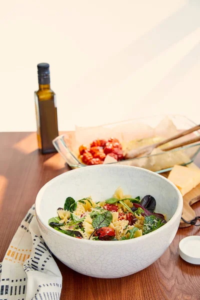 Bowls Pasta Salad Salt Bottle Olive Oil Baking Dish Napkin — Stock Photo, Image