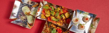 panoramic crop of delicious chinese food in takeaway boxes on red  clipart