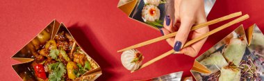 panoramic concept of woman holding chopsticks with steamed bun near tasty chinese food in takeaway boxes on red clipart