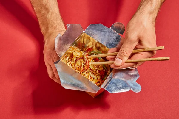 Top View Man Holding Chopsticks Spicy Noodles Red — Stock Photo, Image