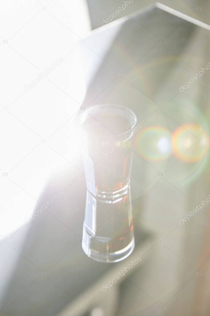 fresh soda in glass with reflection in sunlight